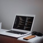 Coding Languages - turned on MacBook Air on desk