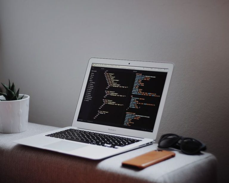 Coding Languages - turned on MacBook Air on desk