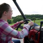 Kids Chores - a person driving a tractor