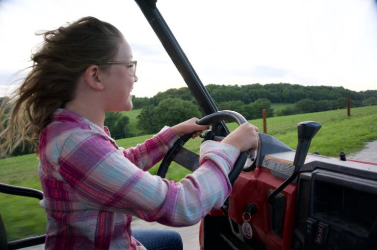 Kids Chores - a person driving a tractor