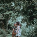 Sibling Rivalry - boy and girl standing in middle of forest trail