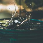 Water Conservation - water drop on bucket photo