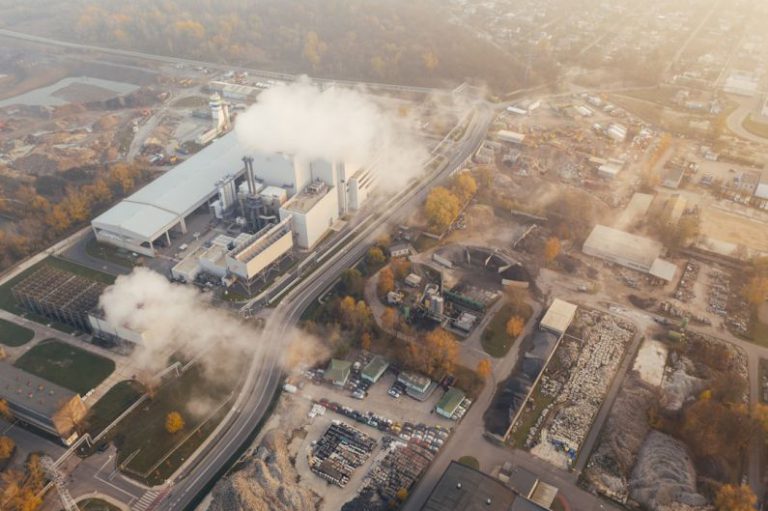 Carbon Footprint - white smoke coming out from building