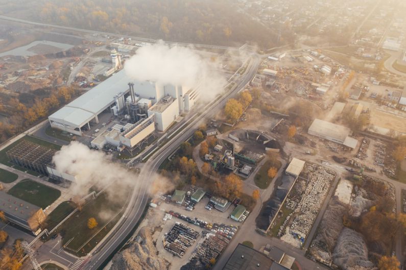 Carbon Footprint - white smoke coming out from building