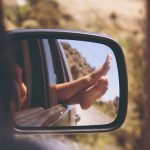 Road Trip Car - person's leg resting on vehicle window