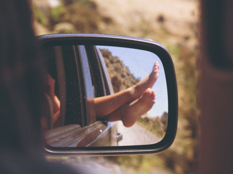 Road Trip Car - person's leg resting on vehicle window