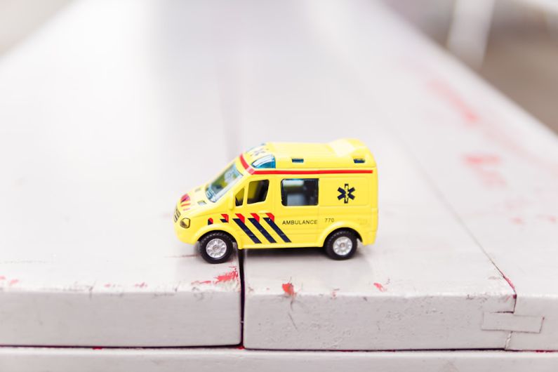 Car Emergency Kit - yellow car toy on white surface