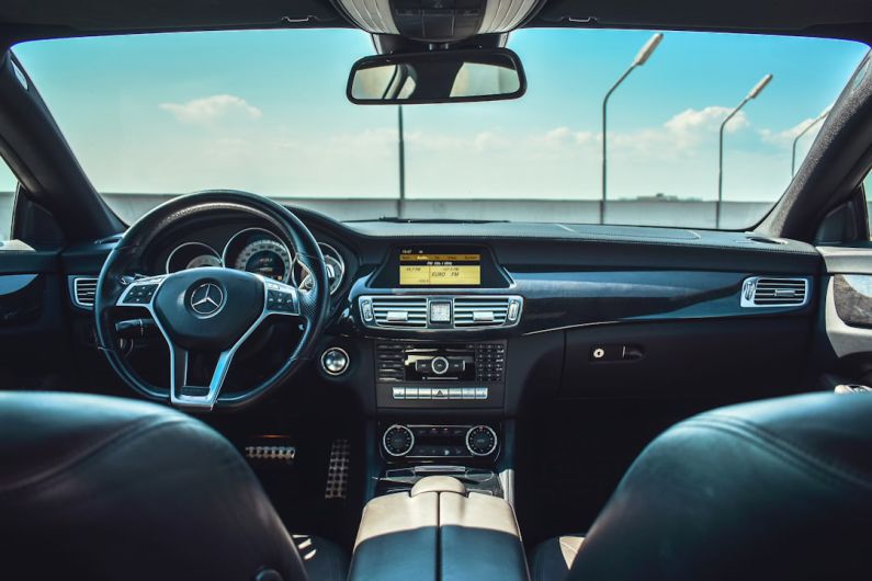 Car Interior - black Mercedes-Benz vehicle steering wheel