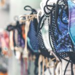 Generic Products - a row of bras hanging on a wall