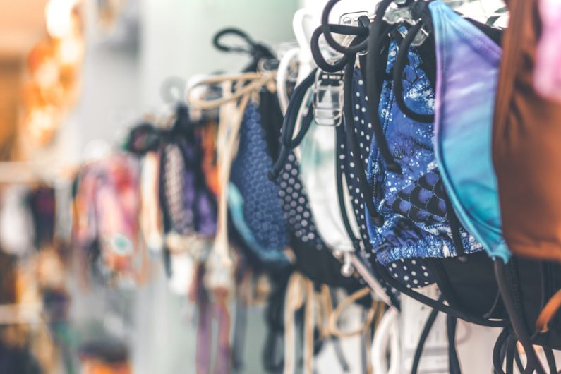 Generic Products - a row of bras hanging on a wall