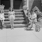 Children Films - grayscale photo of 2 women riding on bicycle