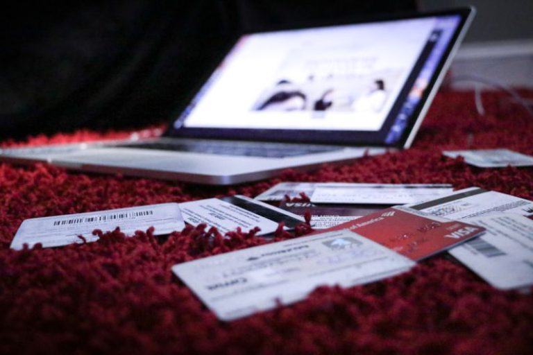 Credit Score - white printer paper on red textile