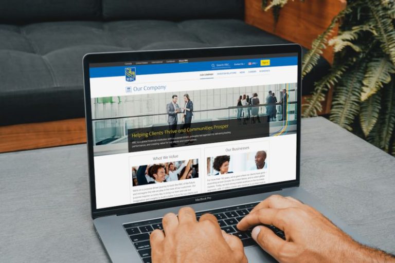 Paying Debt - a man using a laptop computer on a table