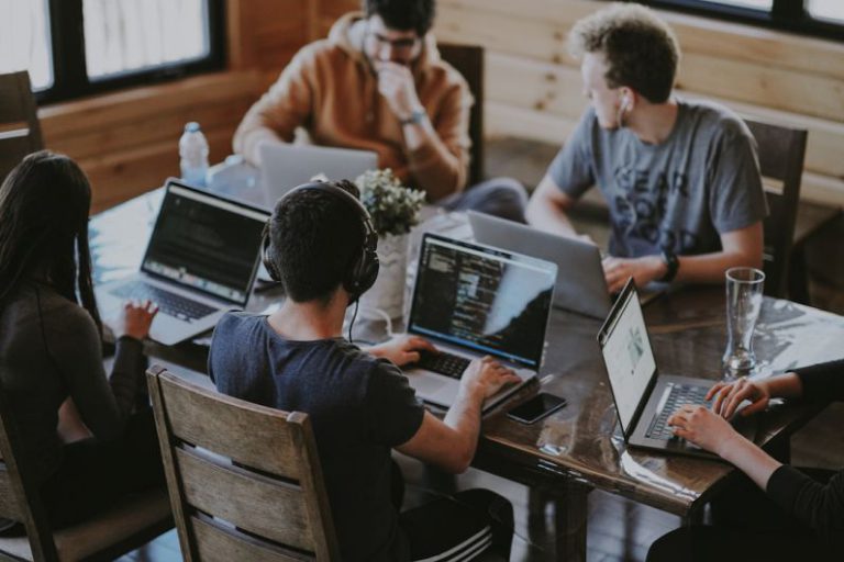 Small Business Finance - group of people using laptop computer