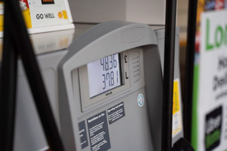 Inflation Impact - a close up of a gas pump at a gas station