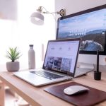 Office Organization - MacBook Pro on table beside white iMac and Magic Mouse