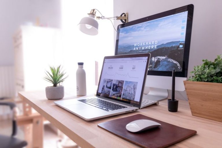 Office Organization - MacBook Pro on table beside white iMac and Magic Mouse