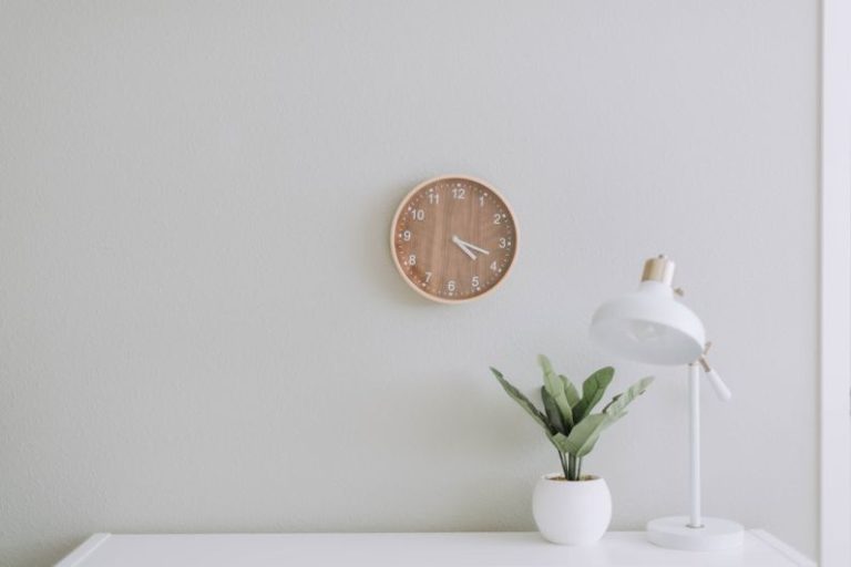 Small Space Organization - white desk lamp beside green plant