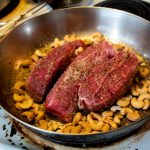 Cooking Steak - cooked meat on stainless steel bowl