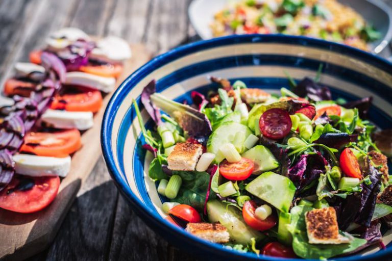 Mediterranean Food - leafy vegetable dish in blue ceramic bowl