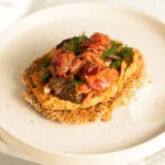 Vegan Recipes - a white plate topped with food on top of a table