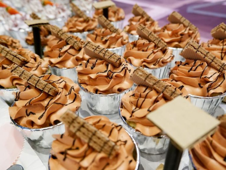 Dessert Recipes - a table topped with lots of cupcakes covered in frosting
