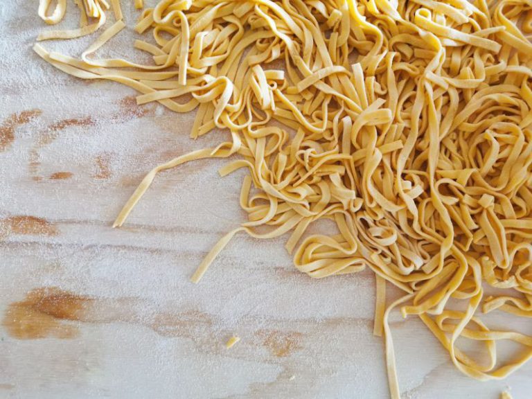 Homemade Pasta - white and brown textile on white textile