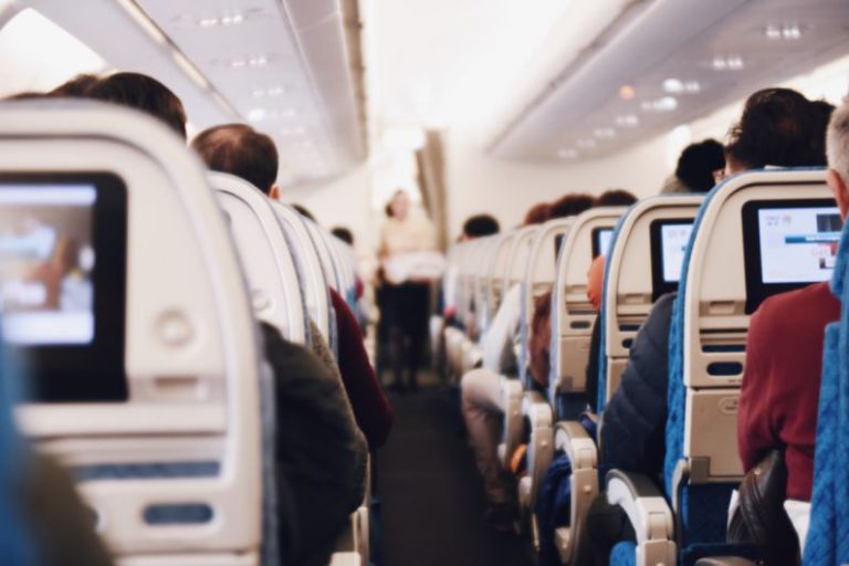 Flight Attendant Tips - shallow focus photography of people inside of passenger plane