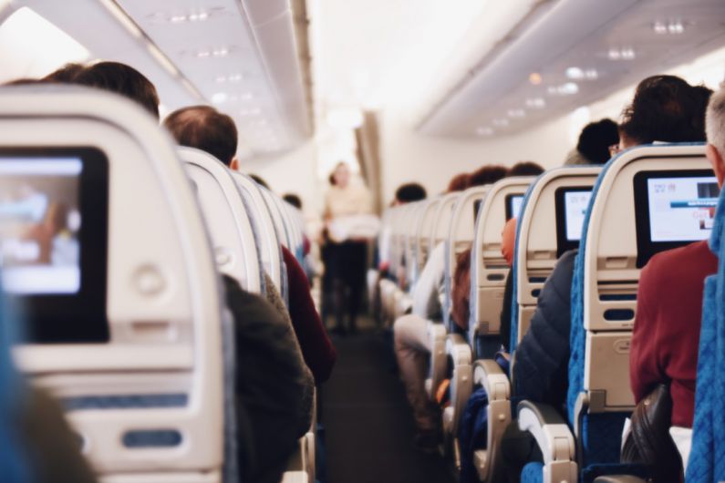 Flight Attendant Tips - shallow focus photography of people inside of passenger plane