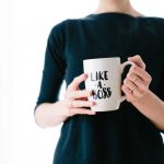 Career Sectors - woman holding white mug while standing