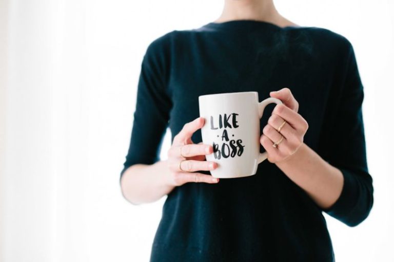 Career Sectors - woman holding white mug while standing