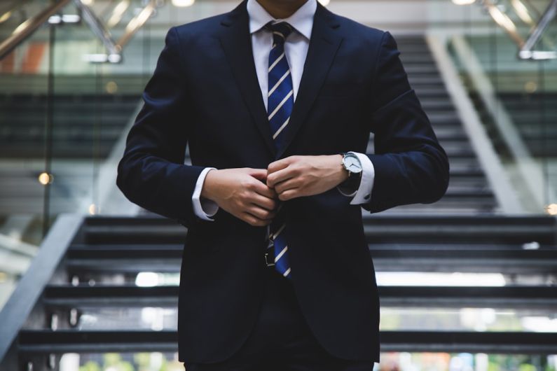 Professional Books - person standing near the stairs