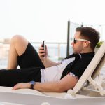 Expat Jobs - man lying on white sun lounger