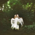 Career Shift - woman in white dress walking on pathway surrounded by trees