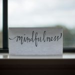 Positive Discipline - mindfulness printed paper near window