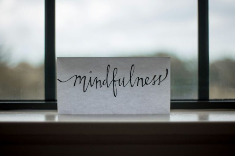 Positive Discipline - mindfulness printed paper near window